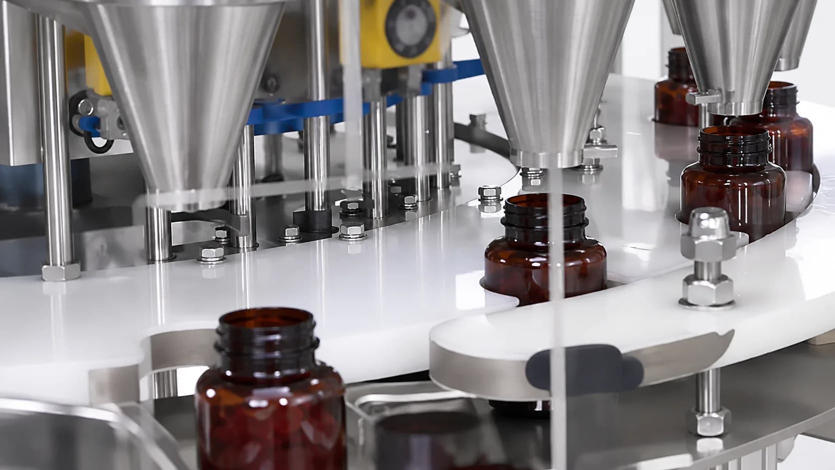 Amber jars at a stainless steel filling station