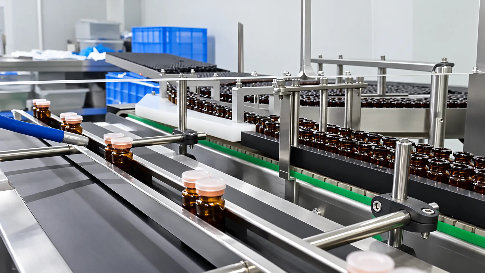 Amber bottles on a stainless steel production conveyor